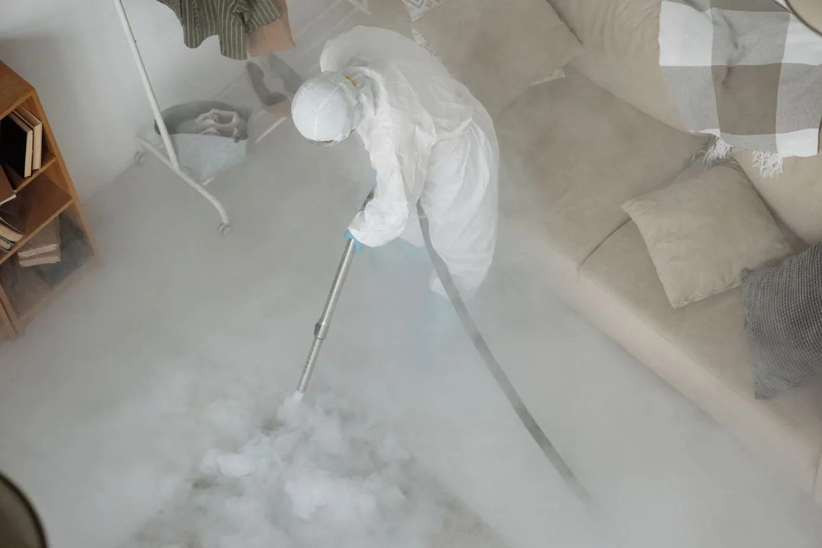 Biohazard cleanup technician in protective equipment, Heflin, AL